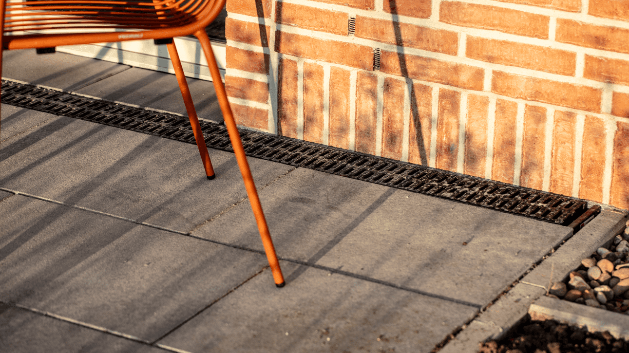 a chair on the terrace with installed ACO Nexite channel