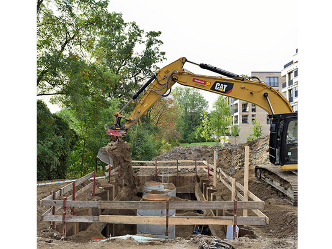 The excavation pit with the stormwater treatment facility is backfilled.