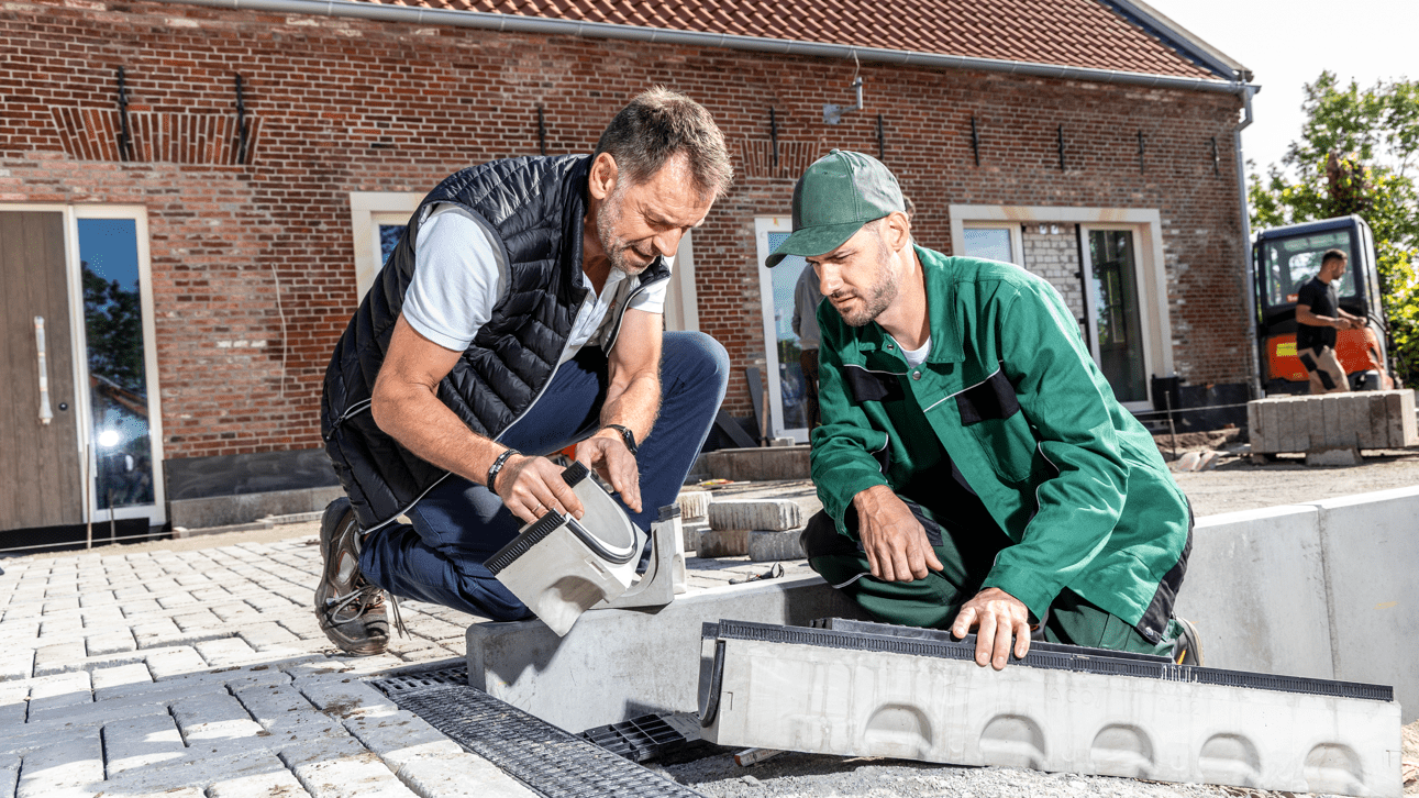two men installing the channel